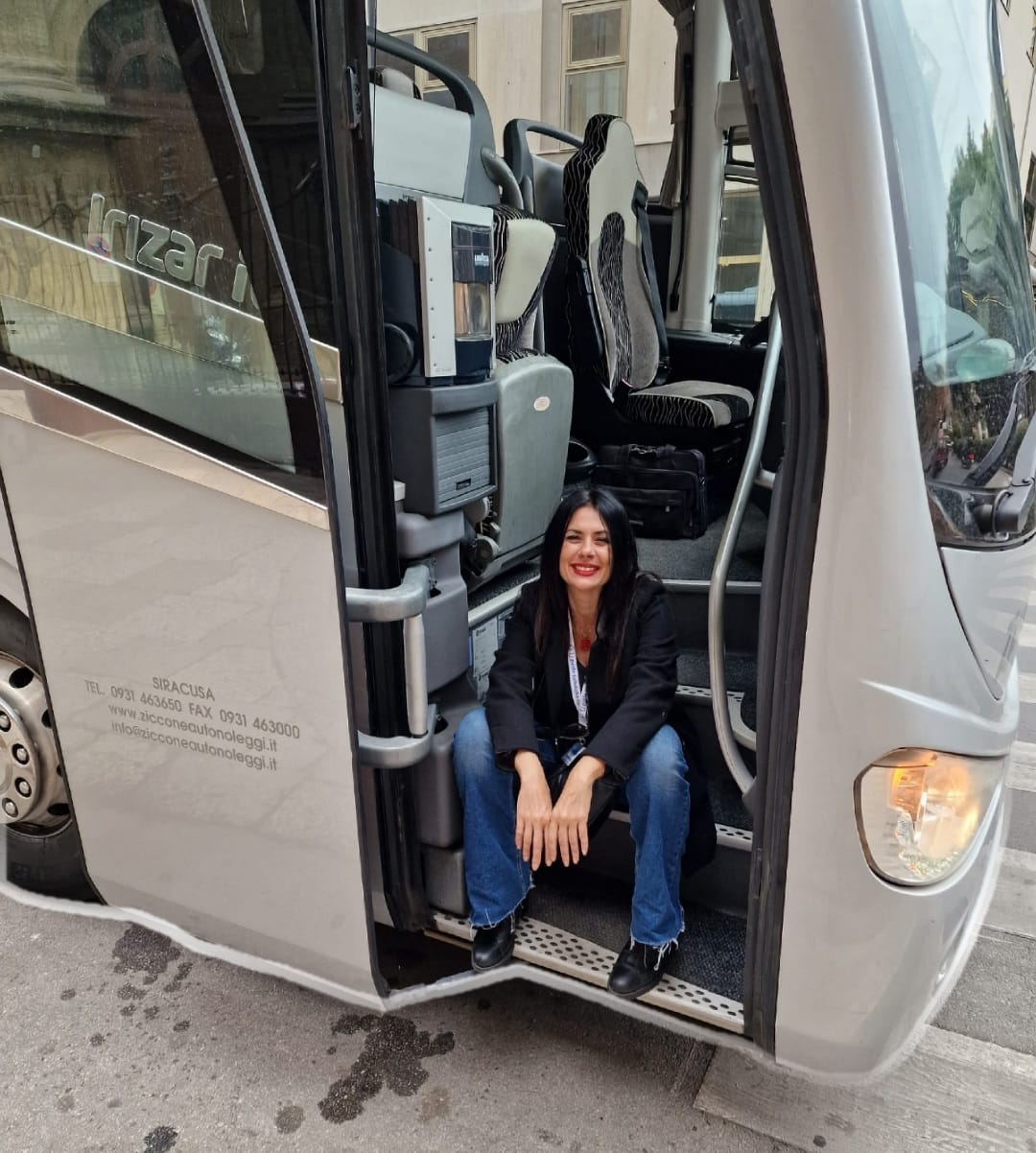 Barbara boarding a private tour coach